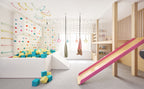 Indoor foam pit in a kids' playroom with a slide and hanging swings