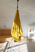 Retro Pineapple sensory swing hanging in bright indoor playroom