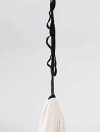 Black 72-inch adjustable daisy chain strap connecting a sensory swing to a ceiling mount.