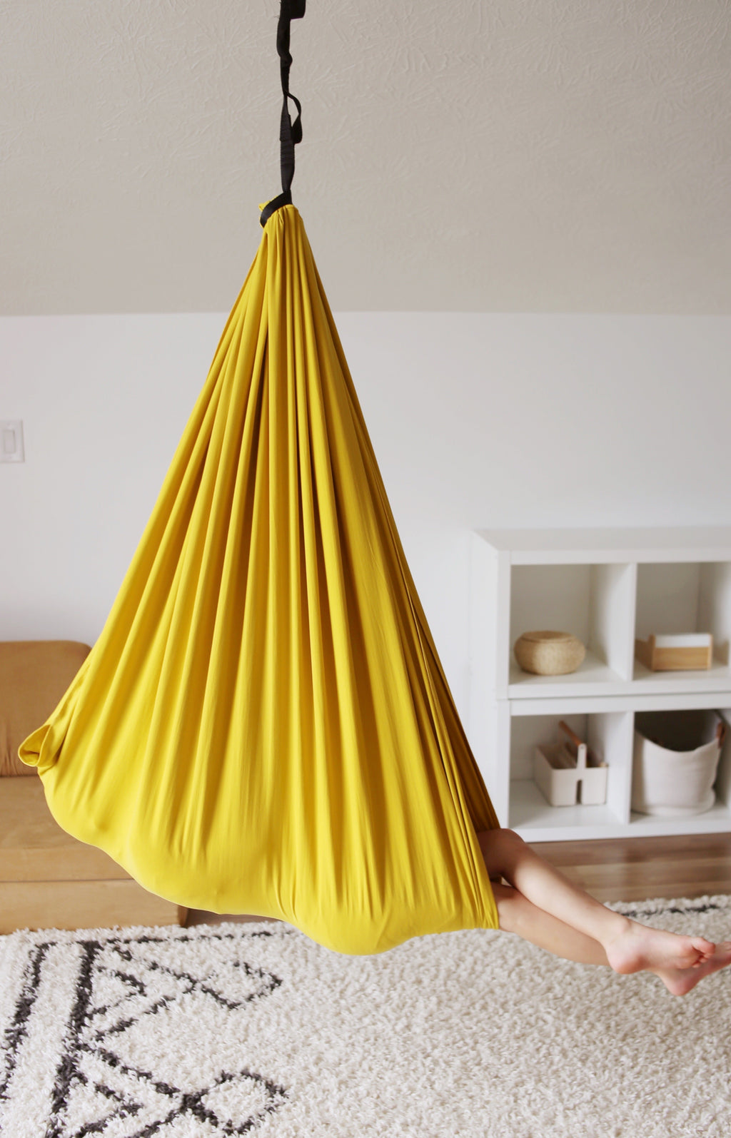 Retro Pineapple sensory swing hanging from playroom ceiling