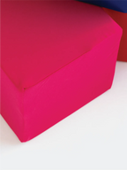 Close-up of a magenta foam cube cover showing the smooth, soft fabric texture