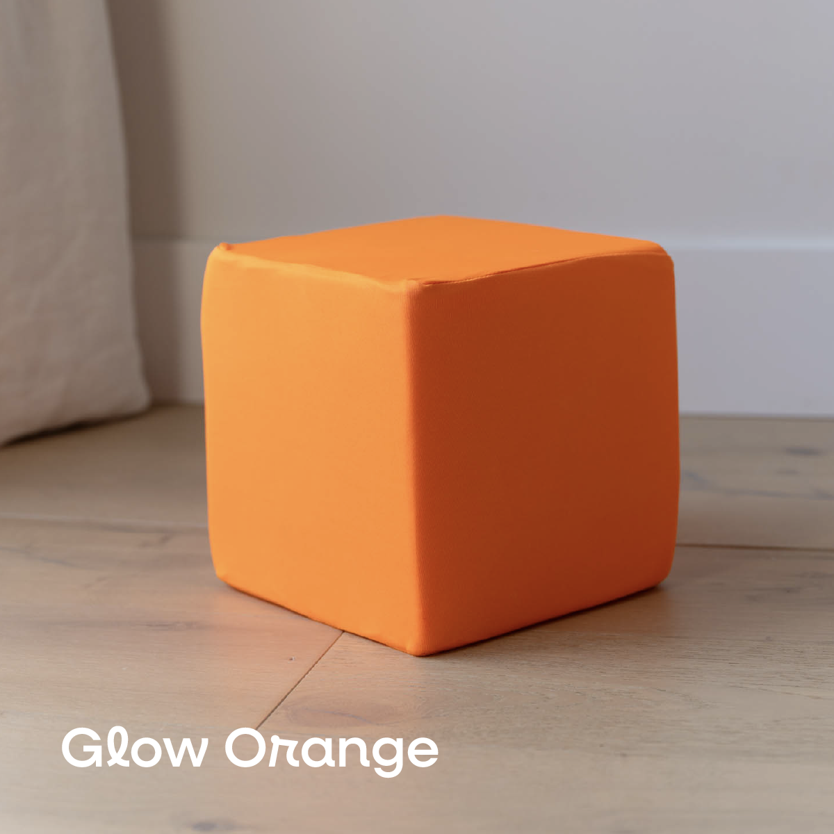 Glow Orange foam cube cover, black light reactive, on a 6-inch foam cube