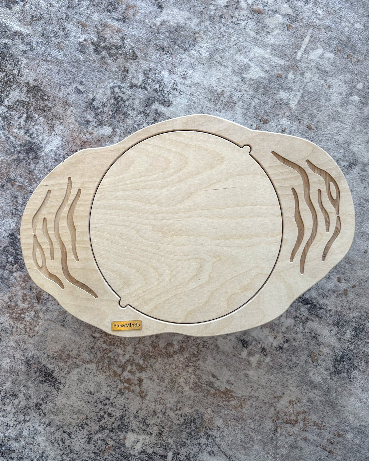 Top view of a plain wooden balance board without a maze