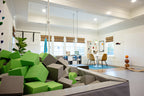 Lime Green and light gray foam cubes filling a foam pit in a family playroom