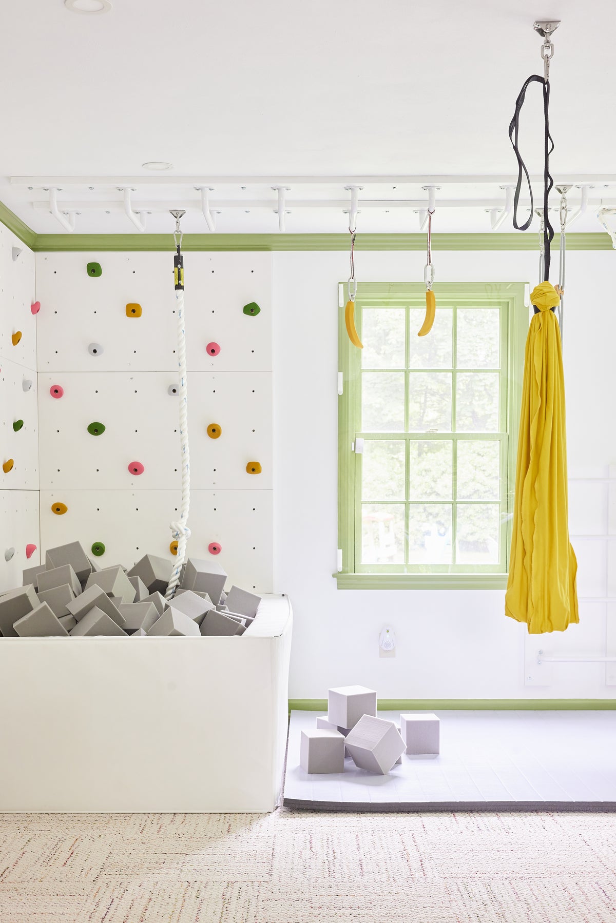sensory swing hanging in active playroom