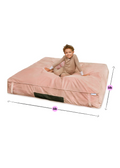 Pink sensory landing  pad for kids with dimensions, child sitting on top