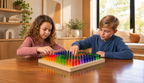 Two children creating designs with a tabletop 24-inch Lite Brite by LiteZilla